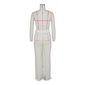 Close-up of white crochet knit beach set showing detailed hollow-out texture on mannequin