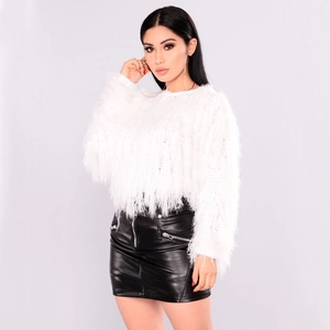 Detail of white plush knit sweater paired with black leather skirt and metal zipper