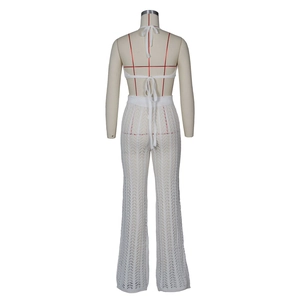 Detail of white crochet knit hollow-out texture on the back of halter top and trousers