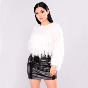 Detail showing white fuzzy plush sweater paired with black leather mini skirt and silver zipper