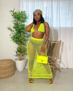 Detail of neon yellow crochet knit two-piece set featuring sheer hollow mesh texture