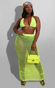 Detail of neon green crochet beach set showing the knit texture and mesh hollow design