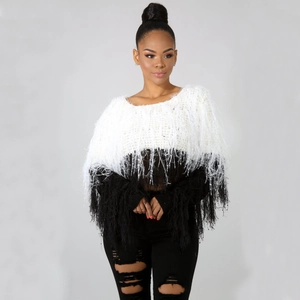 Detail of black and white color block sweater with unique feather fringe texture