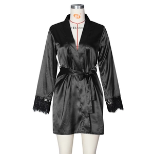 Detailed view of black satin bathrobe sleeve with delicate floral lace trimmings