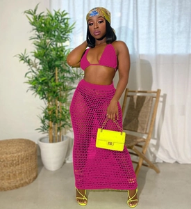 Detail of pink crochet bikini top and hollow-out knit mesh maxi skirt set