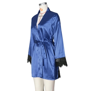 Detail of dark blue satin robe featuring black lace trim on sleeves and belted waist