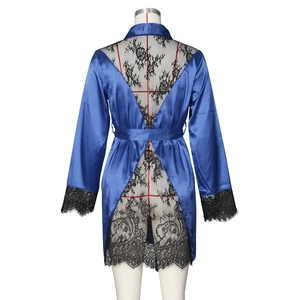 Detail view of royal blue satin robe featuring intricate black floral lace V-back design