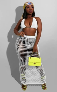 Detailed texture of white crochet two-piece beach set featuring mesh knit hollow out design