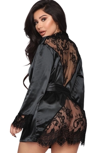 Detailed view of sheer floral lace patchwork on the back of a black satin robe for women