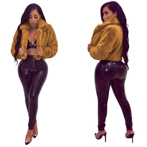 Detailed front and side view of ginger faux fur jacket with wide collar and plush texture
