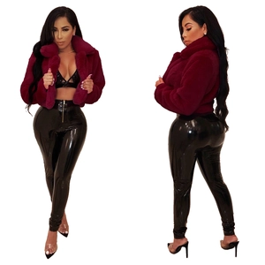 Detailed close-up showing the dense faux fur texture and glossy faux leather material