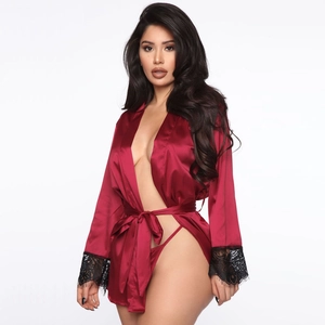 Detail of dark red satin robe featuring elegant black eyelash lace trim on sleeves
