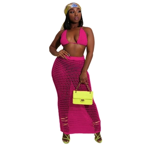 Detail of rose pink crochet bikini top and matching mesh hollow maxi skirt set
