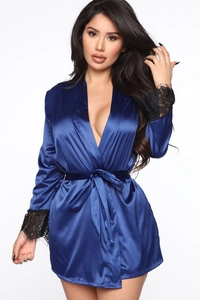 Detailed view of royal blue satin robe with black floral lace cuffs and silk-like texture