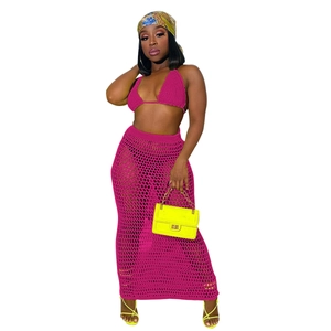Detail of crochet knit beach set featuring high waist hollow mesh skirt and halter top