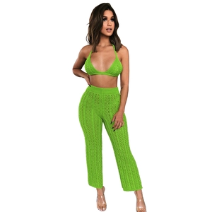Detail of lime green crochet knit set with hollow-out patterns and halter bikini top