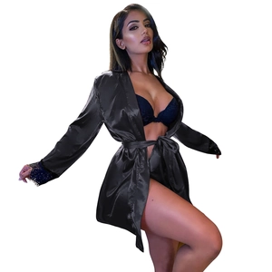 Detailed view of black satin bathrobe with delicate lace trim on the sleeves