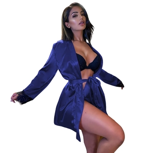 Detail of dark blue satin robe with black lace sleeve cuffs and matching belt closure