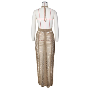 Rear view of hollow knit beach dress showing halter neck design and open back detail