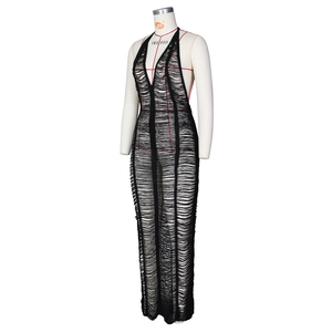 Detail of the black halter neck maxi dress featuring a semi-sheer knitted texture