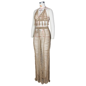 Detailed knit pattern of beige crochet beach set featuring fringe and cutout design