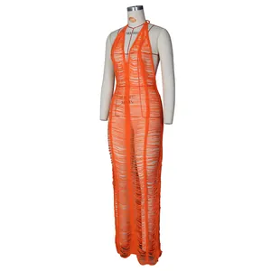 Detail of orange knitted beach cover-up with halter V-neck and hollow-out ripped texture