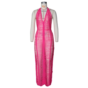 Detailed view of rose pink knit beach dress featuring trendy cutout torn stitch textures