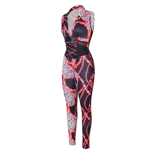 Detail of chain and leopard print jumpsuit featuring front lace-up corset and lapel collar