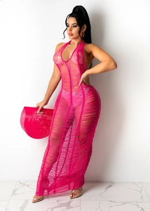 Detail view of pink crochet beach maxi dress with halter neck and sheer fringe texture