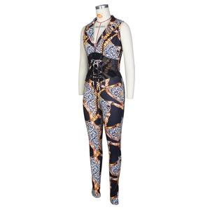 Detail of leopard print and gold chain pattern jumpsuit with mesh waist and drawstrings