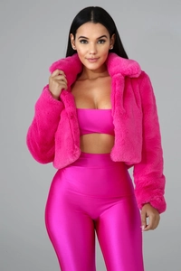 Detail of bright rose pink faux fur jacket showing plush texture and large lapel collar