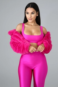 Detail view of the plush texture on this bright pink faux fur cardigan and sports set