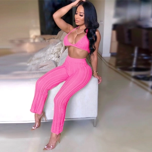 Detail of hot pink knit two-piece set featuring sheer crochet pattern and hollow-out texture