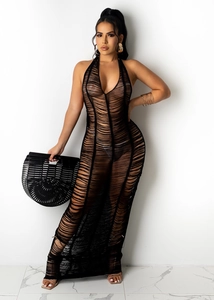 Detail of sheer black knit fabric texture and deep V-neck halter design on beach dress