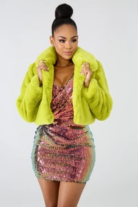 Detail of lime green faux fur jacket paired with colorful gradient sequin mini dress