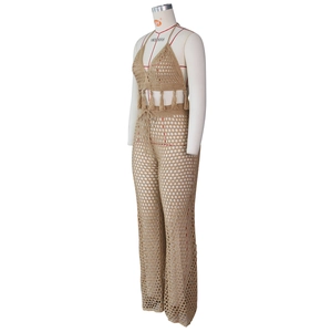 Detail of crochet knit two-piece set featuring mesh hollow texture and fringed hemline