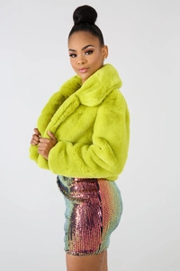 Detailed texture of vibrant lime green faux fur jacket with stylish wide lapel collar