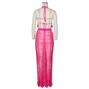 Detail of rose pink crochet knit two-piece set with hollow out design and long fringe hem