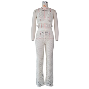 Detailed knit texture of white crochet two-piece set featuring mesh hollow-out patterns