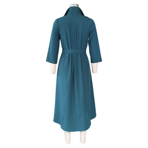 Rear view of a dark teal shirt dress featuring a turn-down collar and waist tie details