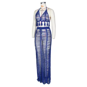 Detailed knit pattern on dark blue two-piece beach set with tassels and hollow-out design