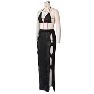 Detail of black crochet two-piece set featuring side hollow-out knit skirt and bikini top