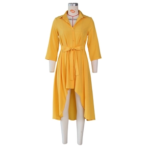 Detail view of yellow asymmetric shirt dress with waist drawstring and high-low hem design