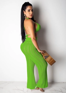 Detail of crochet hollow knit fabric and high waist wide leg pants in neon green