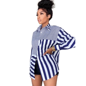 Detail of loose-fit shirt dress with unique patchwork blue and white stripe patterns