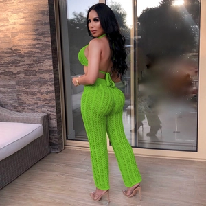 Detail view of neon green crochet set showing halter top and wide leg pants texture