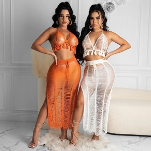 Women's crochet beach set with halter fringe top and side slit skirt in white and orange