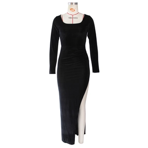 Detail of square neckline and vertical velvet texture on a slim black long-sleeve dress