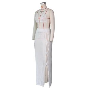 Detailed knit texture of white crochet bikini top and high slit skirt beach set