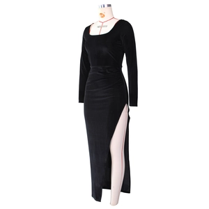 Detailed close-up of side pleats and ruched texture on black square neck velvet gown